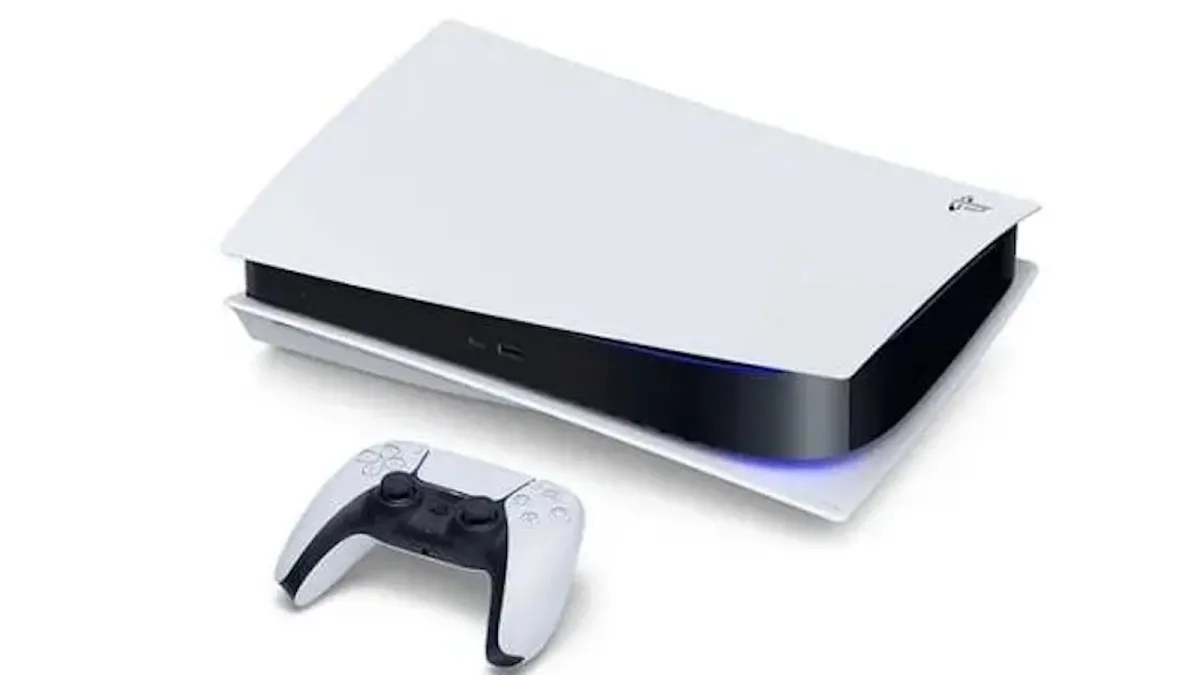 A PS5 lying on its side with a controller next to it.